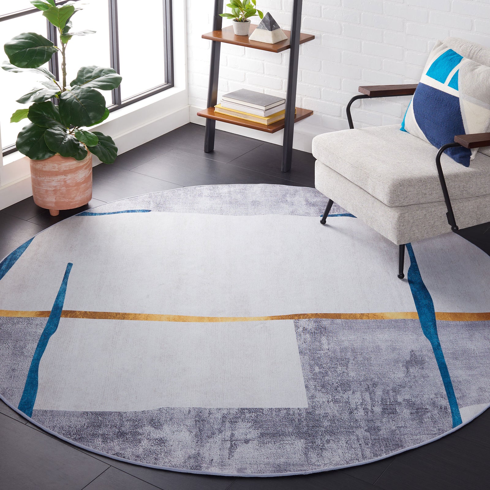 Modern round rug anchors the room with soft gray tones, teal streaks, and a sleek gold accent || TAC820F-6R || top_room