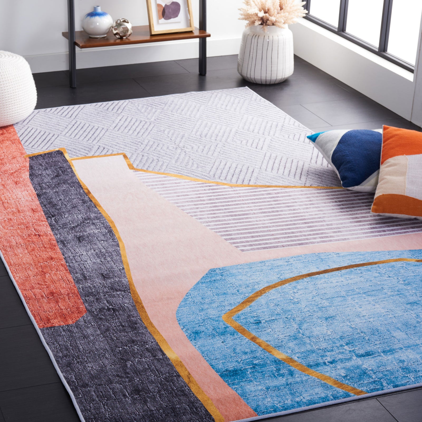 Contemporary geometric rug brings lively color and pattern to the living space. || TAC834B-5 || front_angle_room