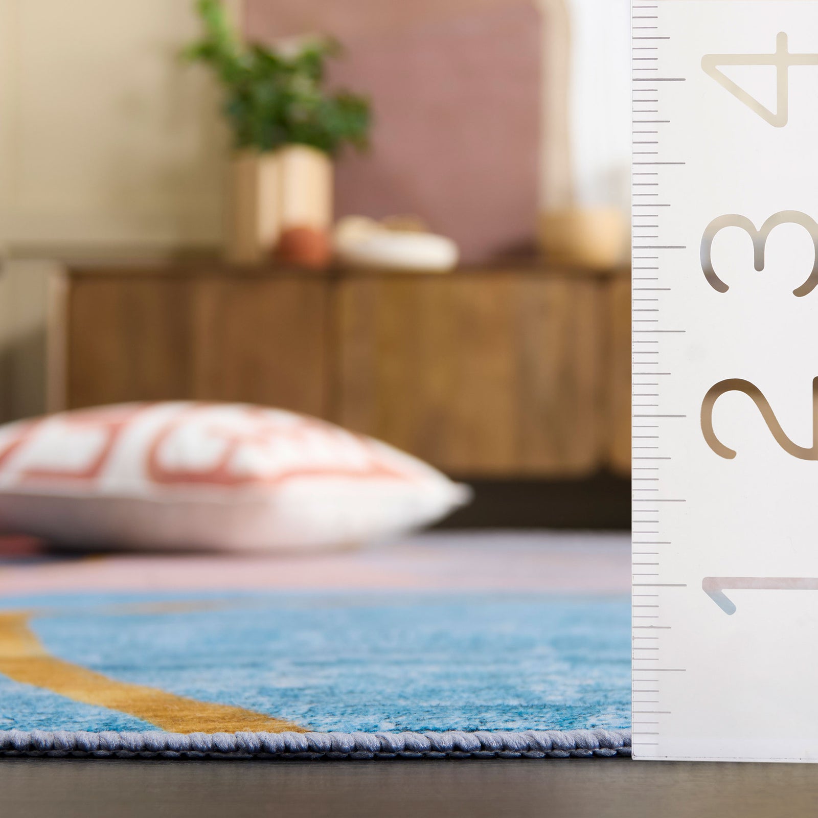 Low-profile rug design sits flush to the floor for a sleek look and easy door clearance || TAC834B-5OV || dimension_room