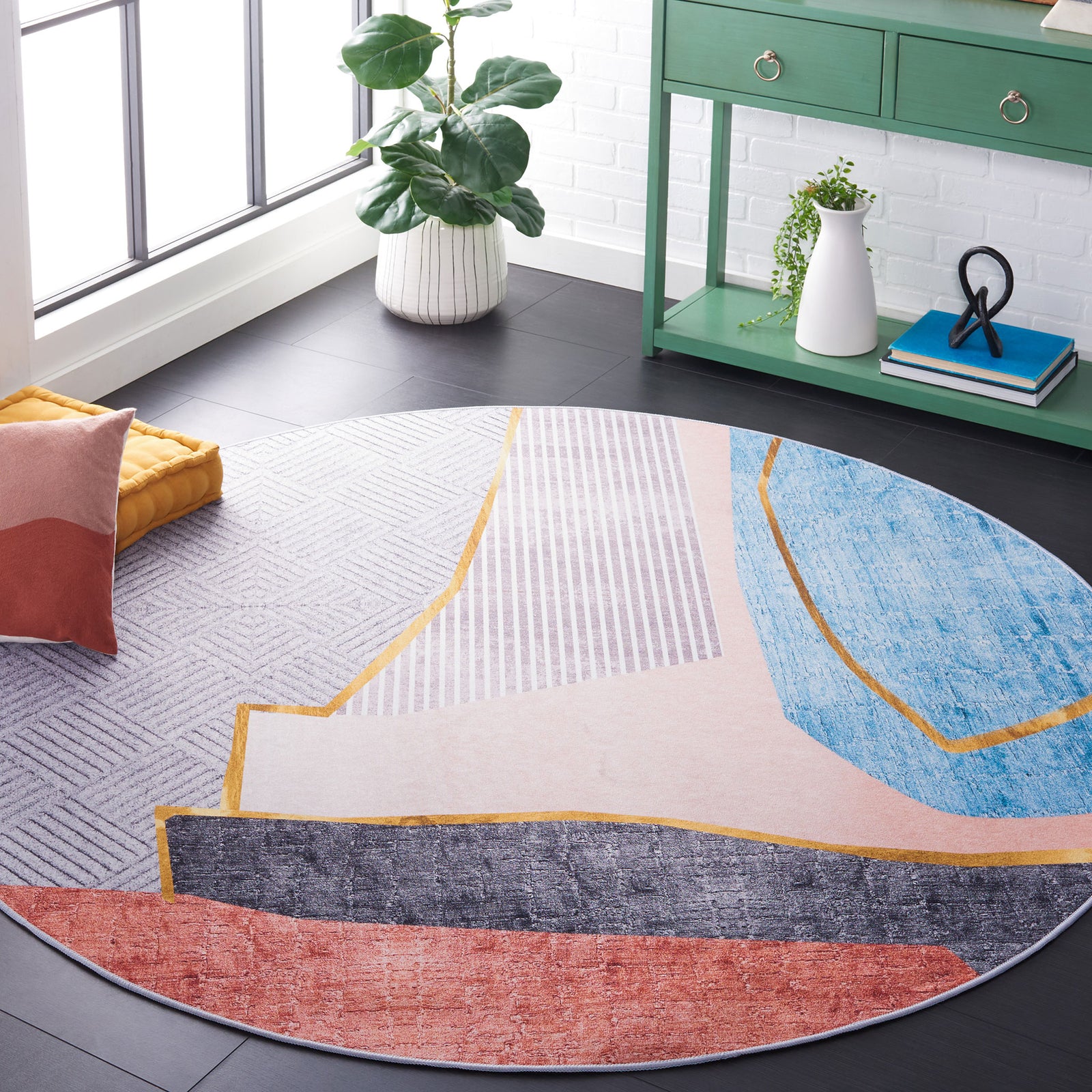 Modern round rug adds bold color blocks and warm gold accents to elevate the living space || TAC834B-6R || front_angle_room