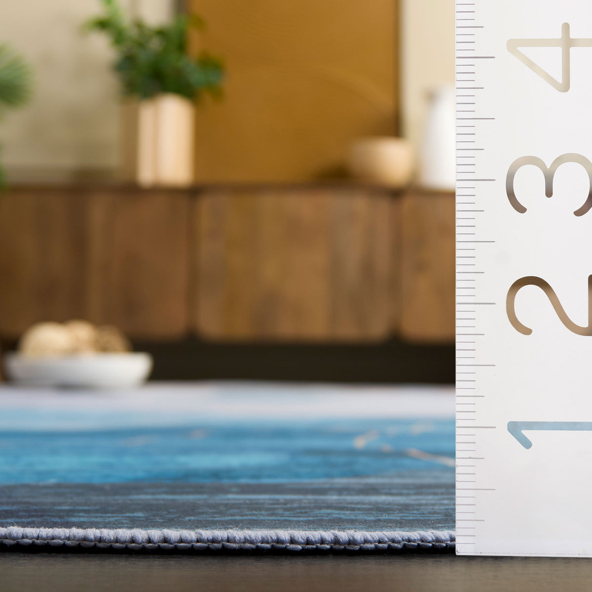 Low-profile edge and smooth weave for easy placement under doors and furniture. || TAC836M-5OV || dimension_room