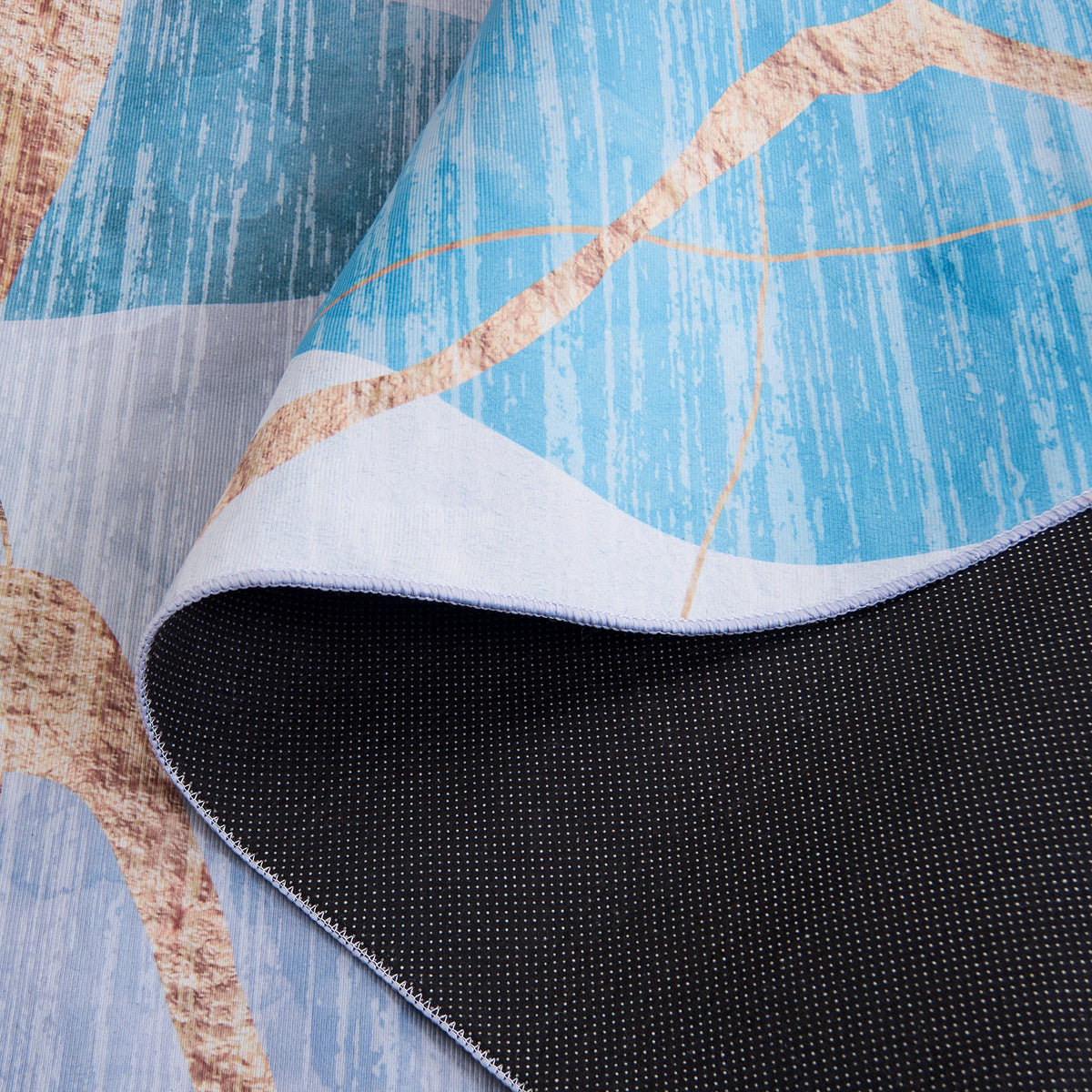 Slip-resistant dotted backing pairs with a smooth face in layered blues with warm gold streaks. || TAC836M-5OV || backing_studio