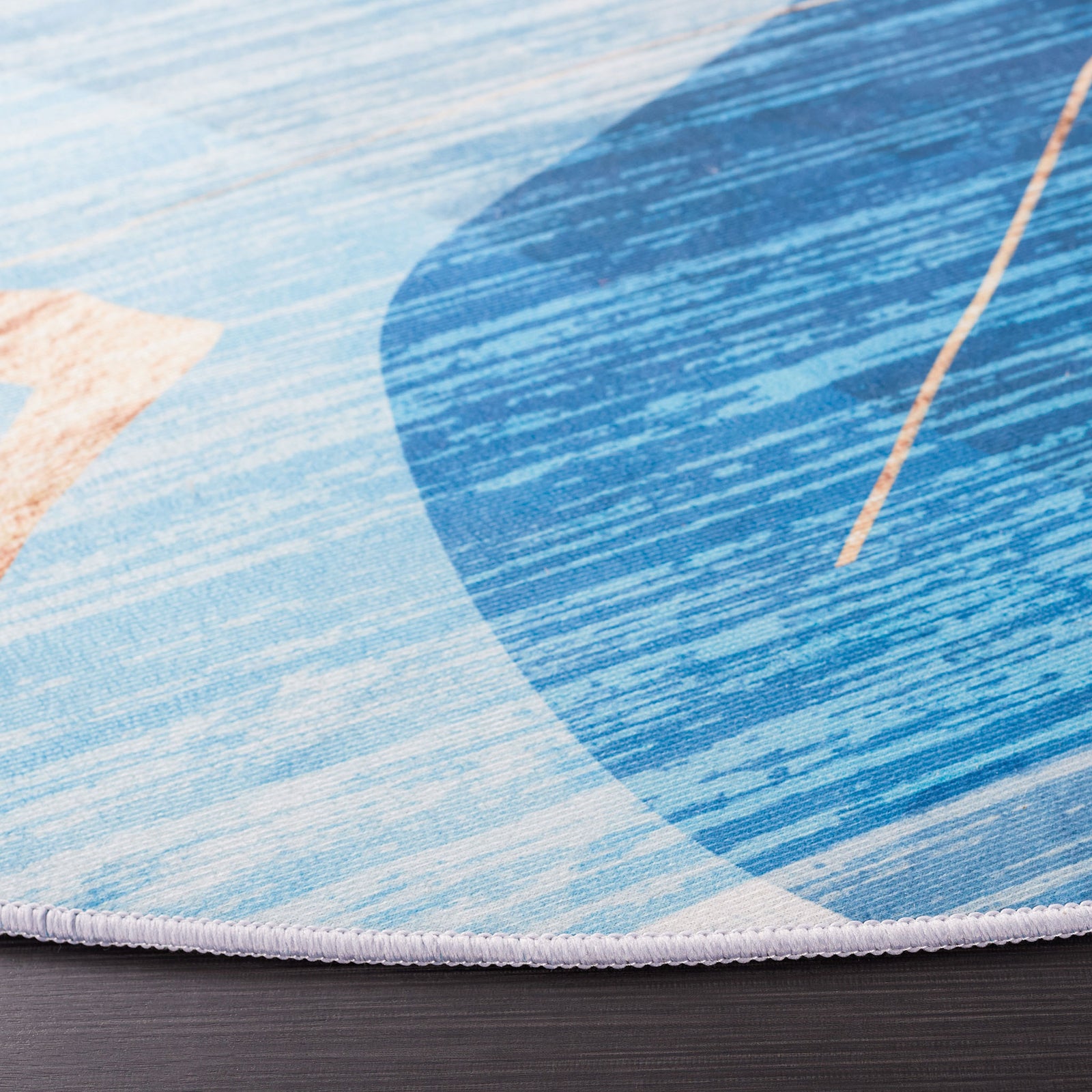 Serged edge and heathered blues highlight the abstract pattern and clean, low-profile finish. || TAC836M-6R || detail_studio