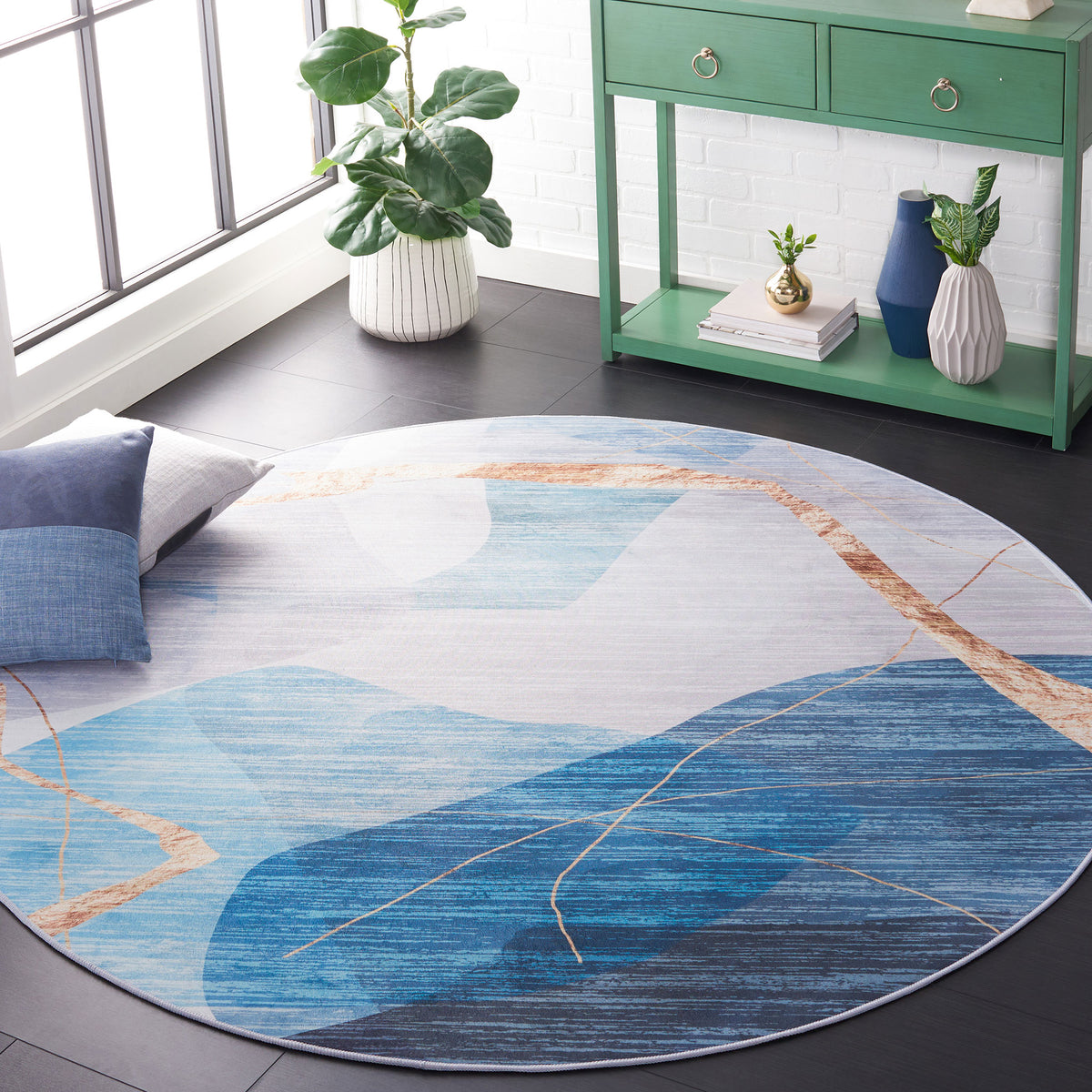 Round rug with sweeping gold lines over tonal blues for a modern, artful focal point. || TAC836M-6R || front_angle_room