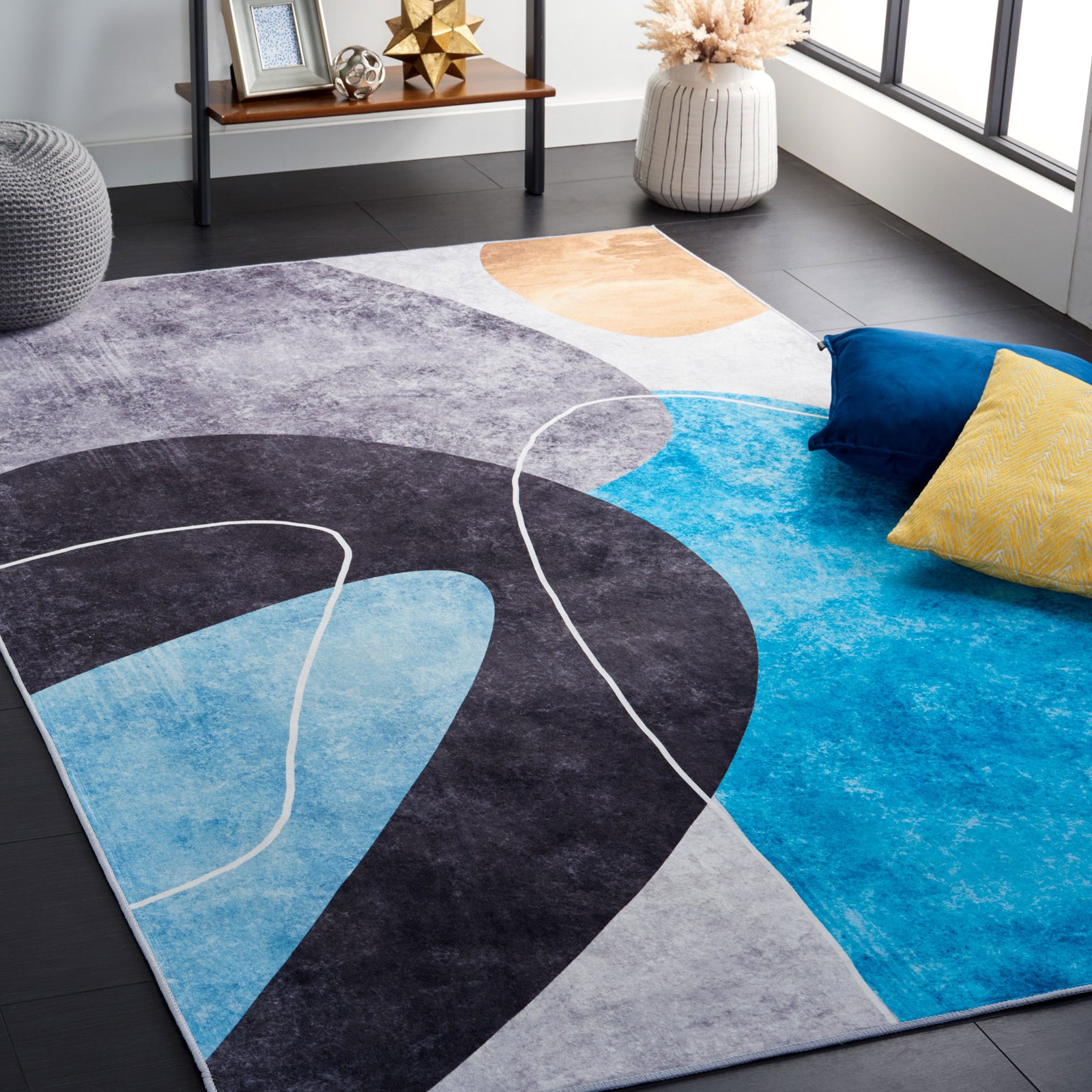 Modern abstract rug brings bold teal and charcoal shapes to brighten the room || TAC837G-5 || front_angle_room