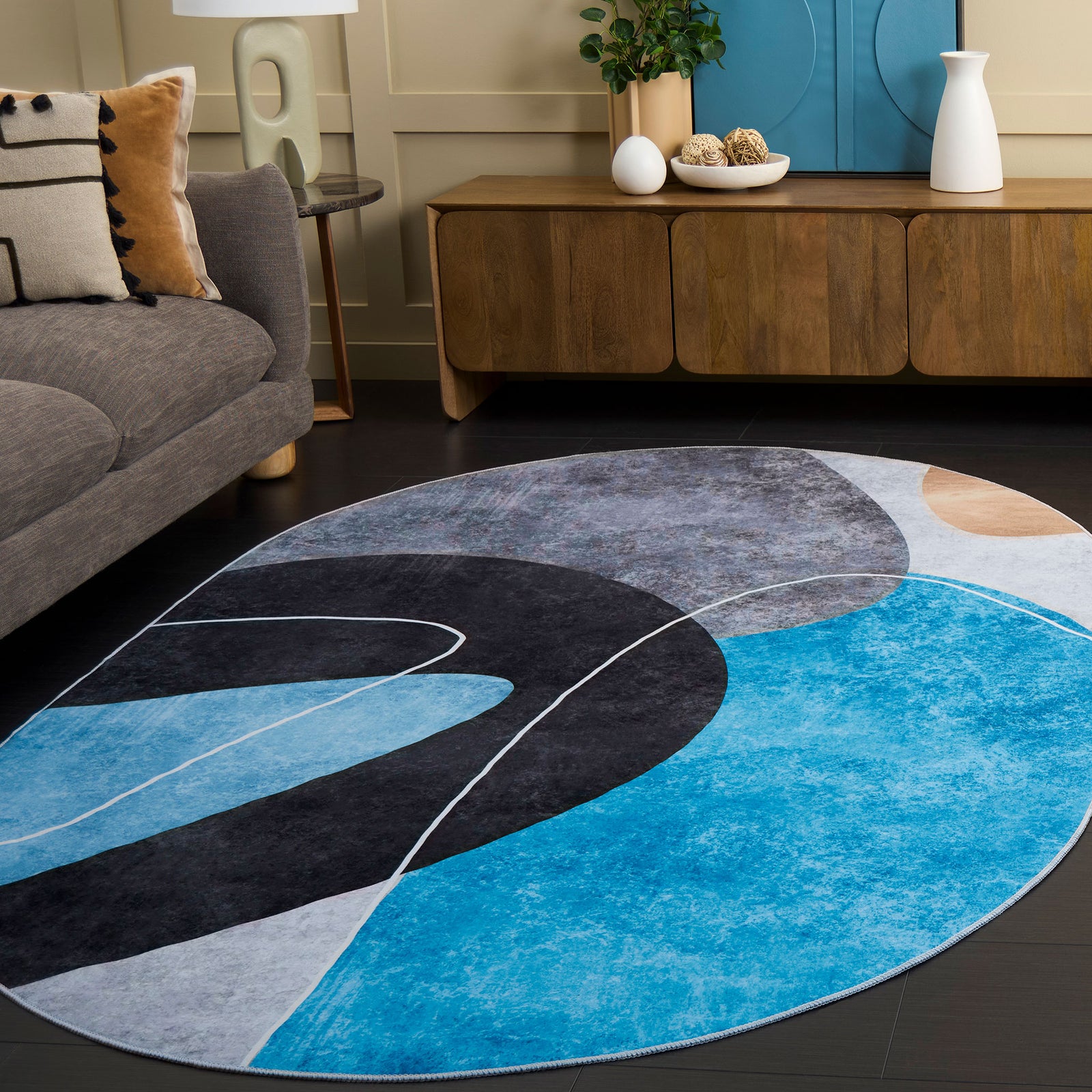 Oval rug brings modern energy with sweeping gray and turquoise arcs. || TAC837G-5OV || front_angle_room
