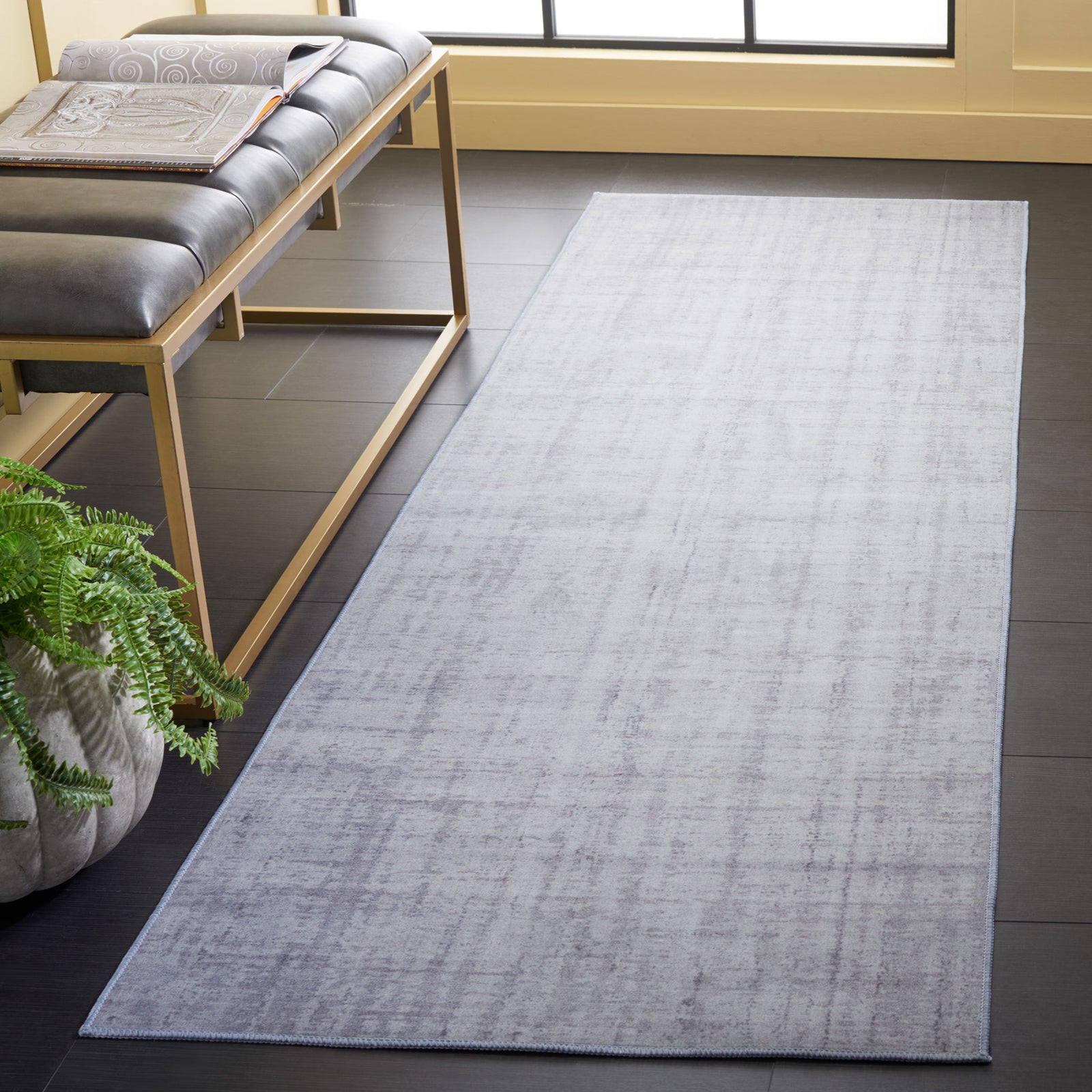 Light gray runner brings a soft, modern touch to a hallway with an understated tonal pattern. || TAC857F-28 || top_angle_room