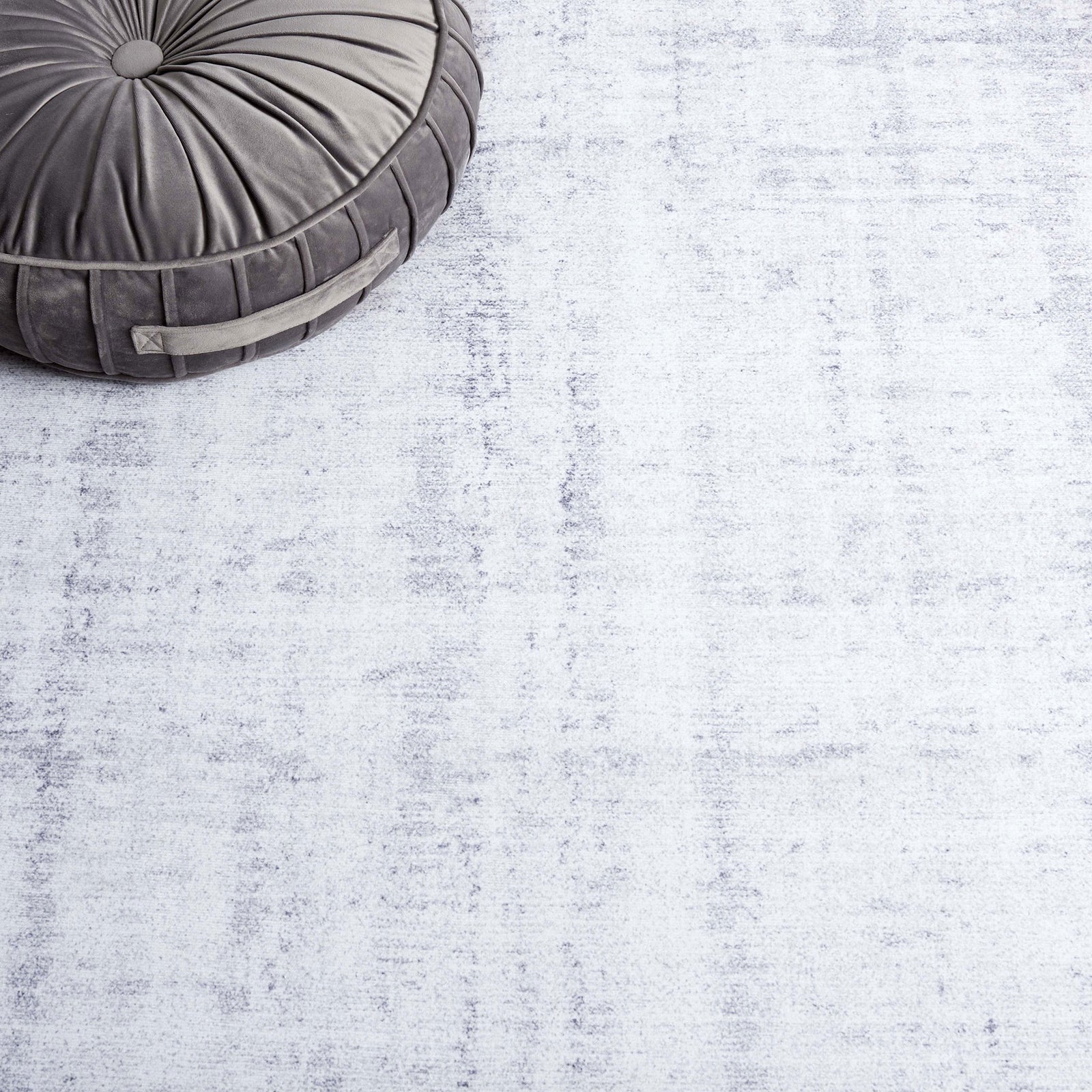 Soft light gray abstract pattern offers versatile style and a comfortable feel underfoot. || TAC857F-5 || detail_room
