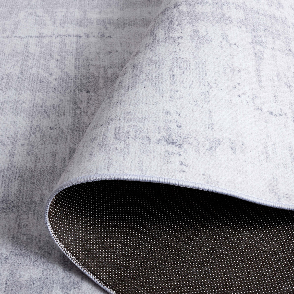 Flexible, machine-washable rug with non-slip dot backing for secure, easy-care use. || TAC857F-5 || backing_studio