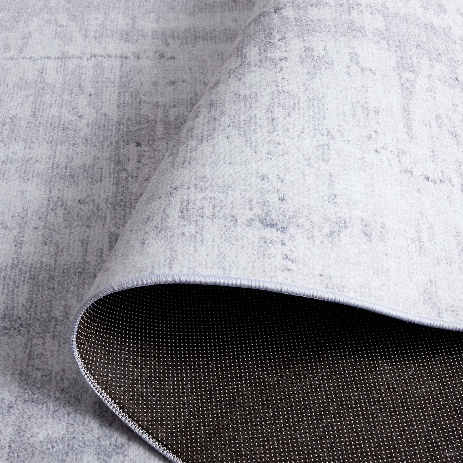 Flexible, machine-washable rug with non-slip dot backing for secure, easy-care use. || TAC857F-5 || backing_studio