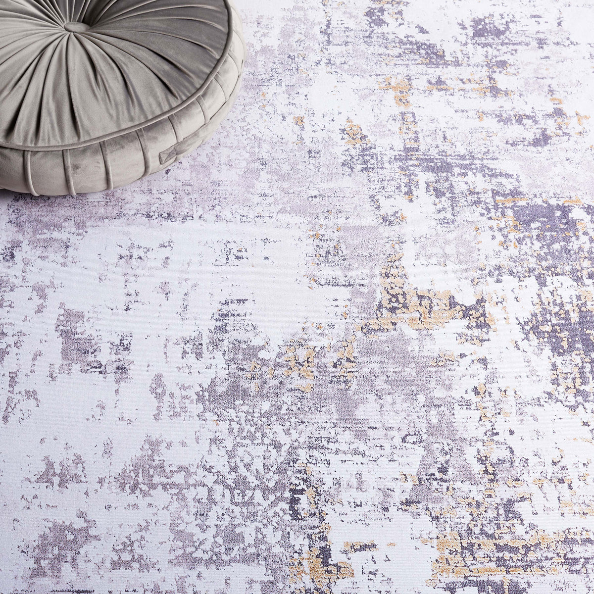 Pattern close-up reveals layered gray tones with gold accents for a softly weathered, modern look. || TAC863F-5 || detail_room