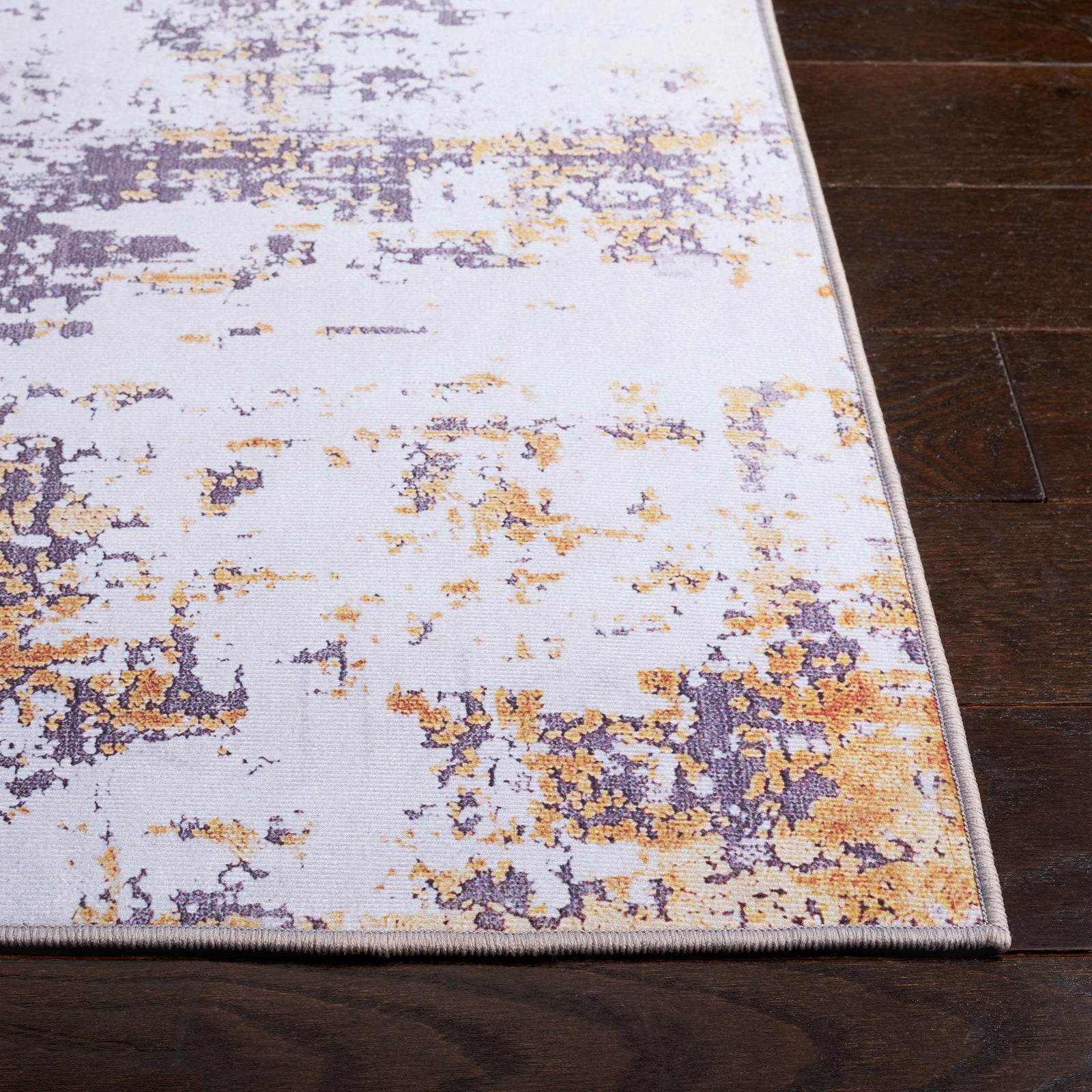 Abstract gray and gold area rug with softly distressed pattern and low-profile edge. || TAC863F-5 || top_studio