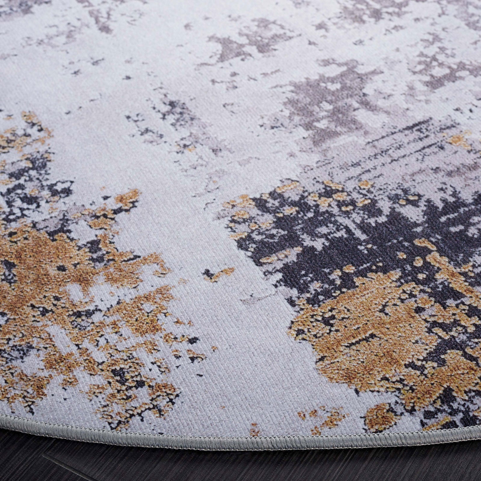 Gray and gold abstract pattern with low-profile pile and neatly serged edge || TAC863F-6R || detail_room
