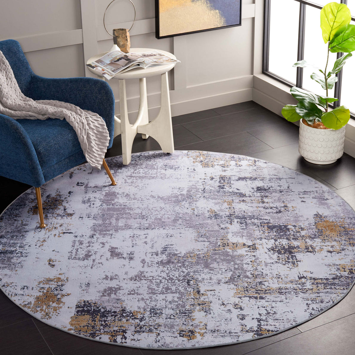 Round gray and gold abstract rug adds a soft, contemporary layer to the living space || TAC863F-6R || top_room
