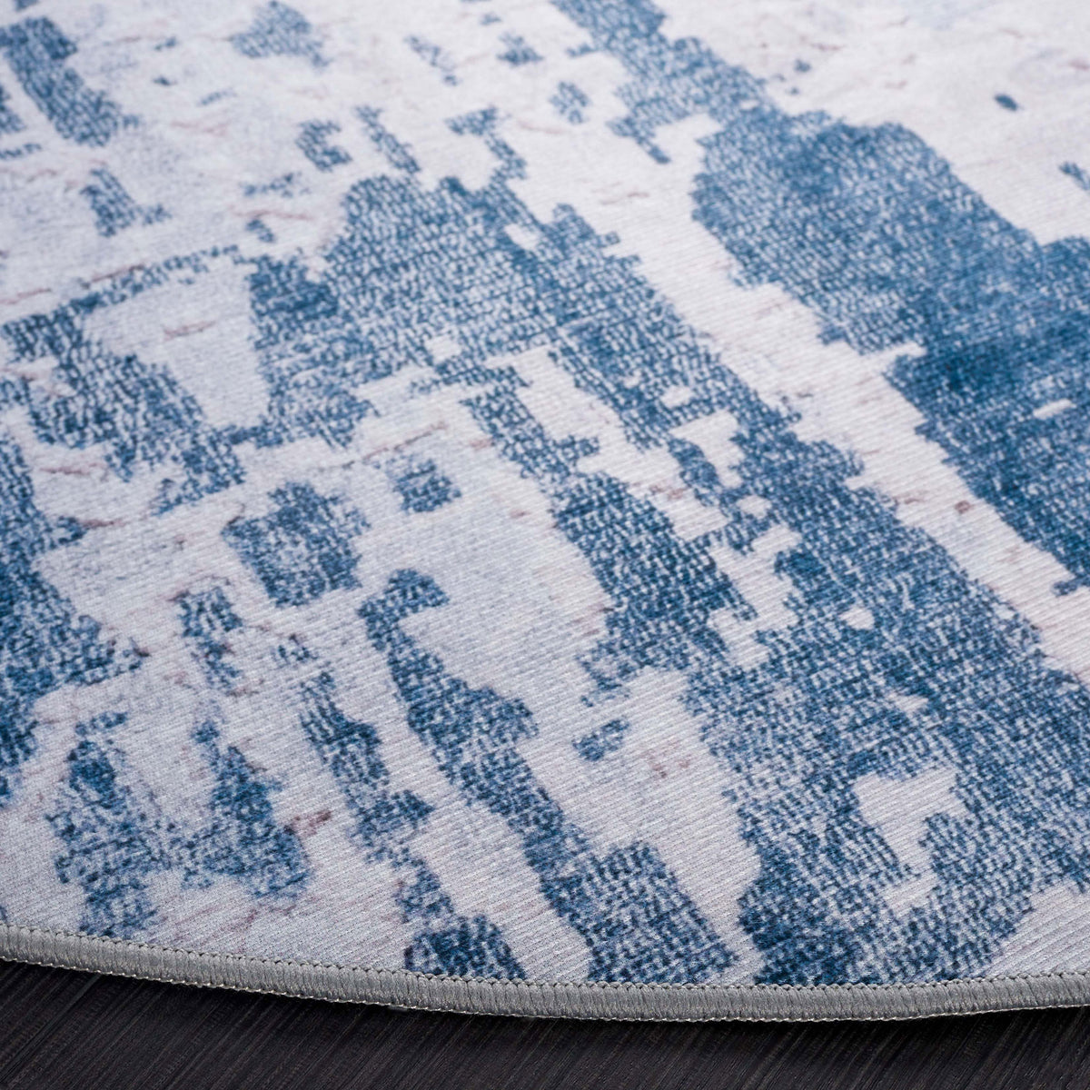 Bound edge and textured abstract gray and navy pattern on this soft, washable rug || TAC864F-6R || detail_studio