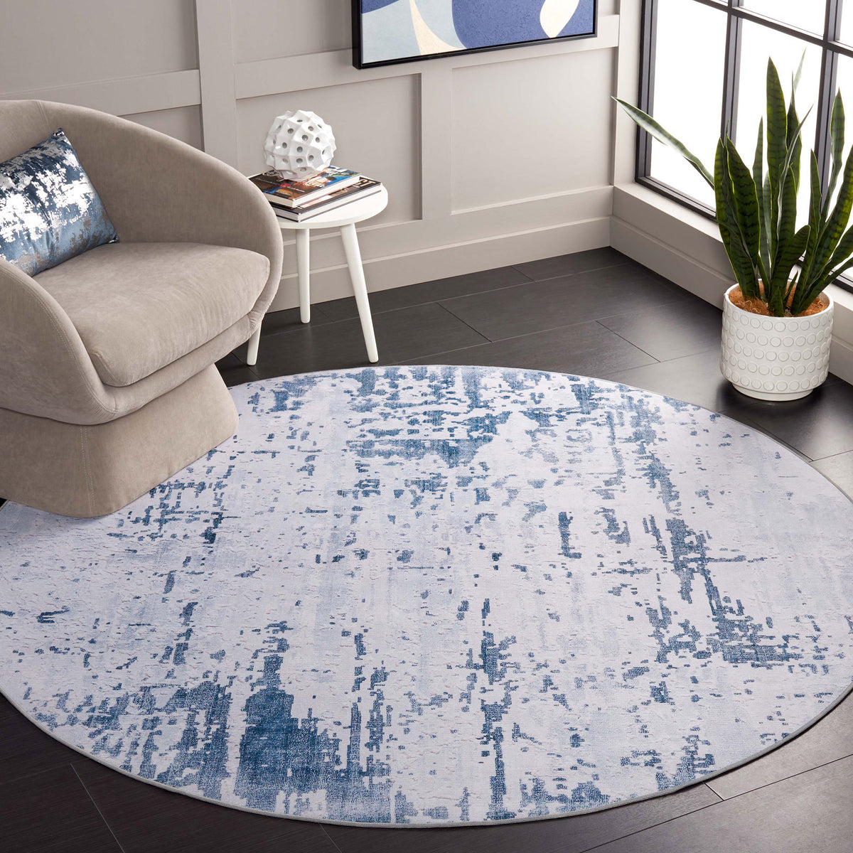 Modern gray and navy round rug anchors the room with a soft, machine-washable, non-slip design || TAC864F-6R || top_room