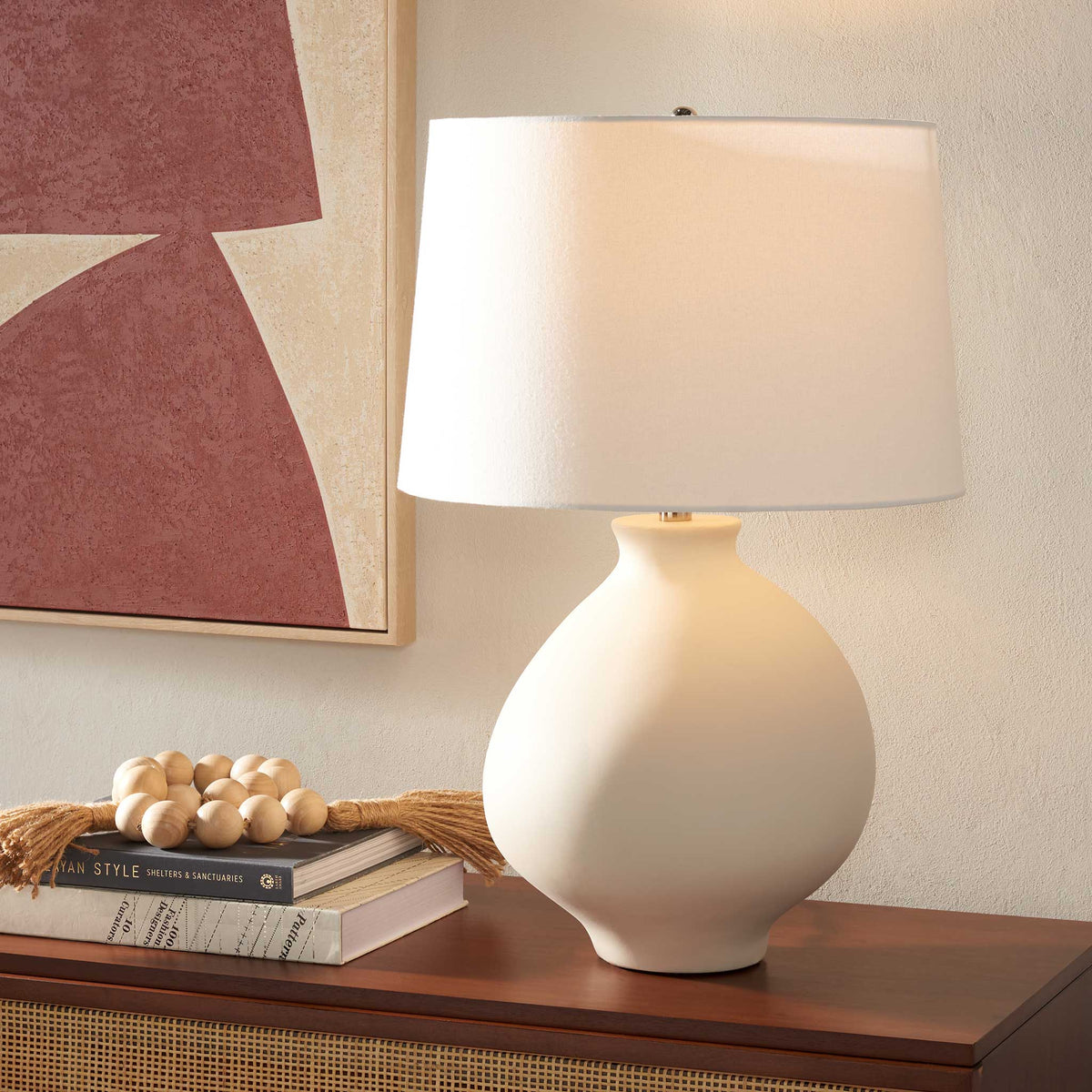 Warm glow from a white ceramic lamp that elevates modern decor with understated style || TBL2009A || front_on_room