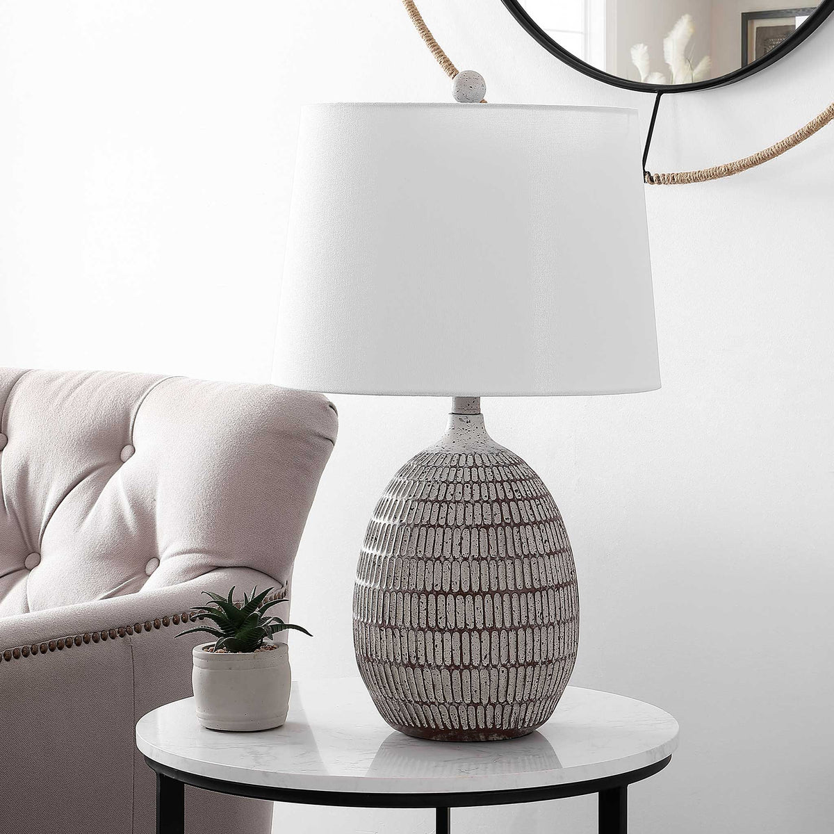 Tapered white shade tops a sculpted brown-and-white resin base with organic texture || TBL4421A || front_angle_room