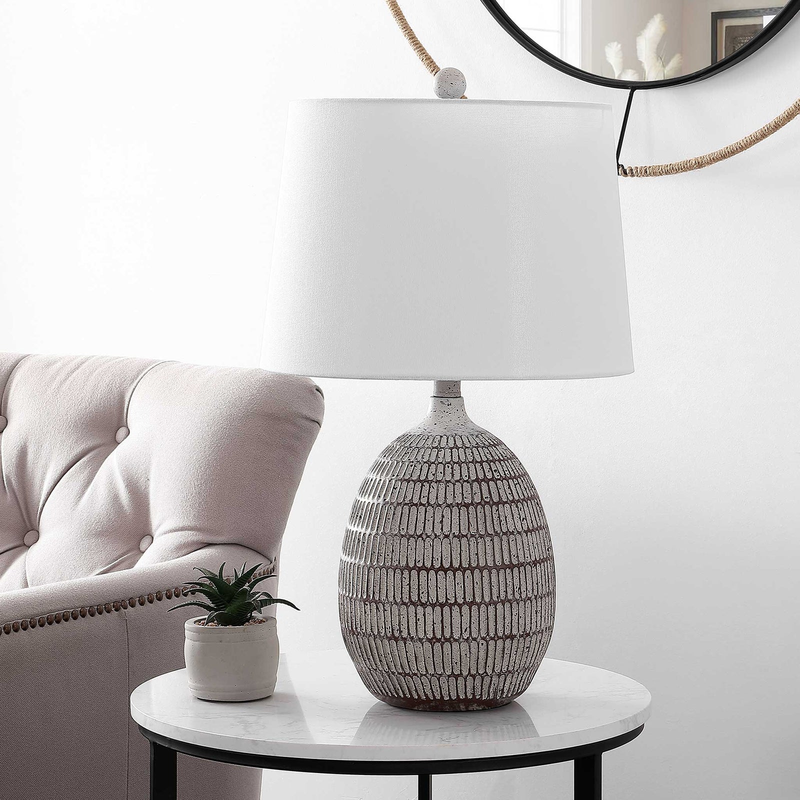 Tapered white shade tops a sculpted brown-and-white resin base with organic texture || TBL4421A || front_angle_room