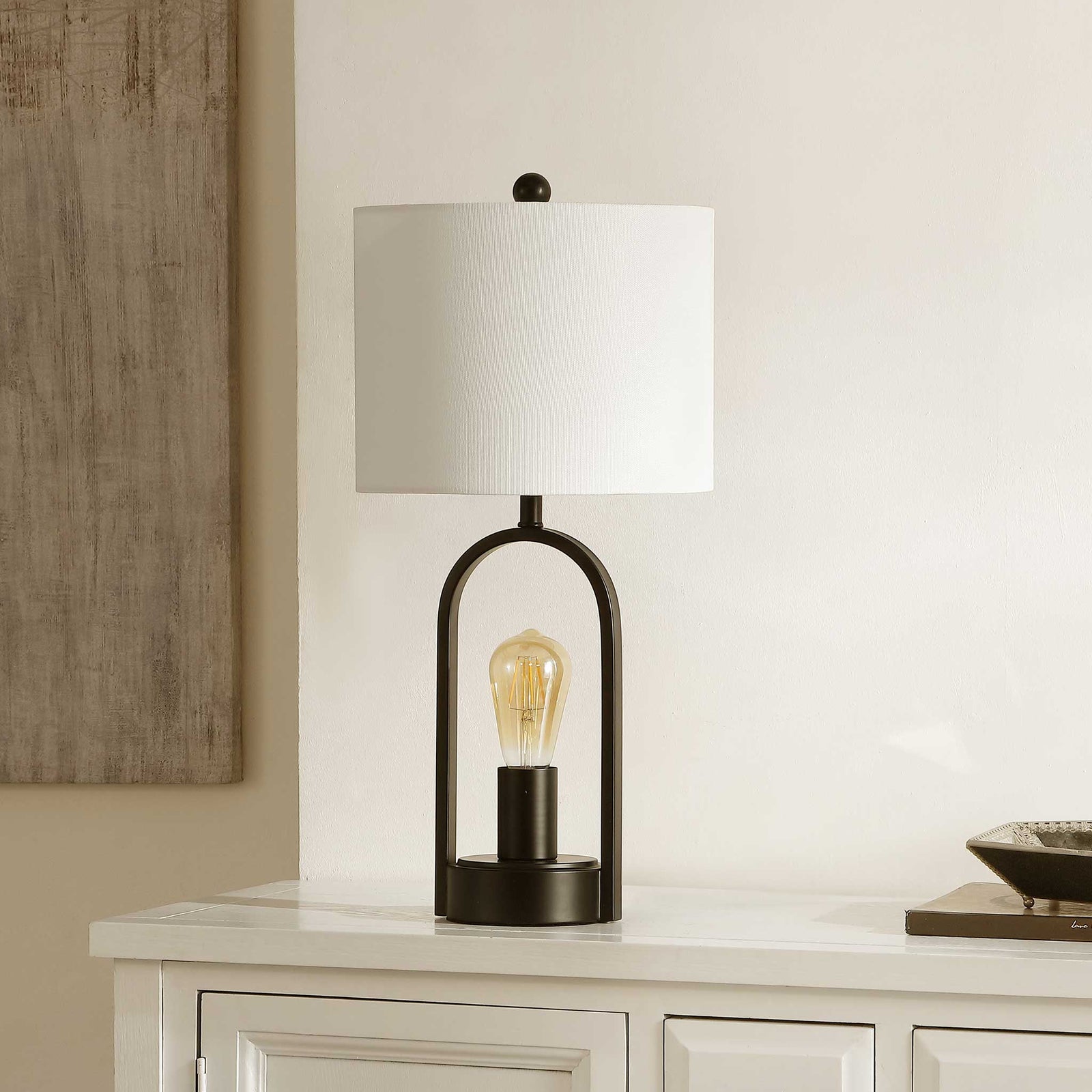 Elegant black arch frame with exposed bulb and crisp white shade || TBL4482A || front_angle_room