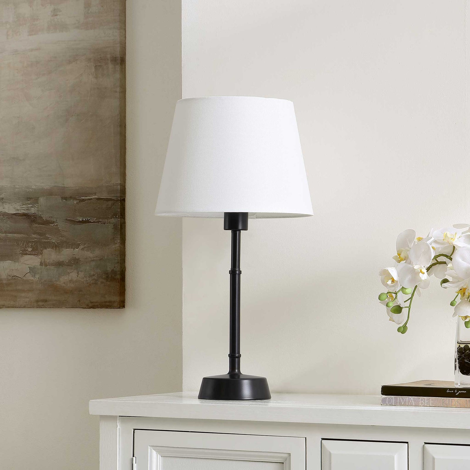 Transitional lamp with matte black base and bright white shade for effortless, neutral style || TBL4491A || front_angle_room
