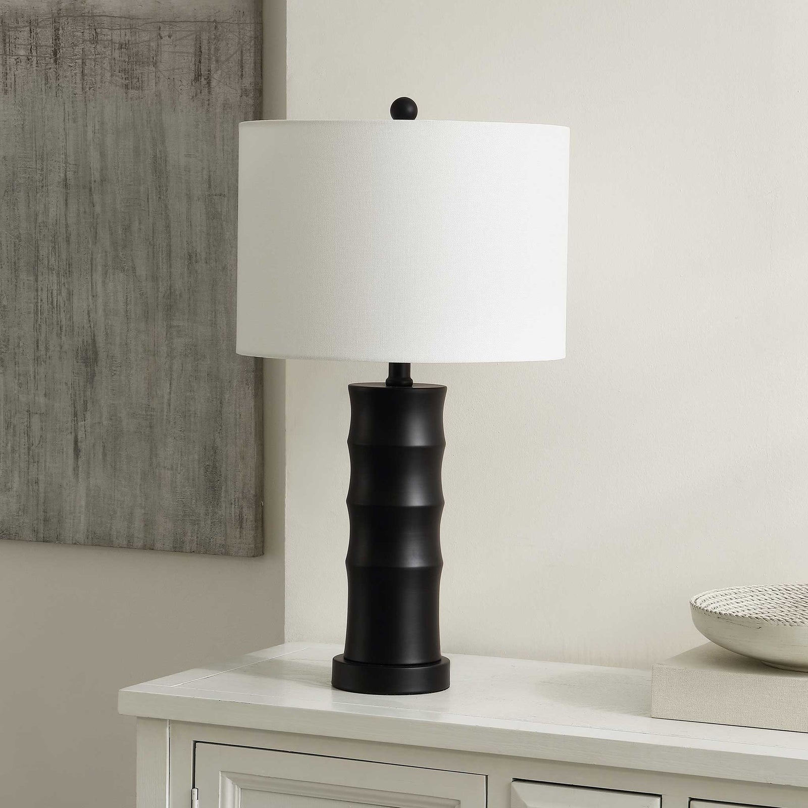 Sleek black iron lamp adds modern edge on a console, paired with a clean white shade || TBL4493A || front_angle_room