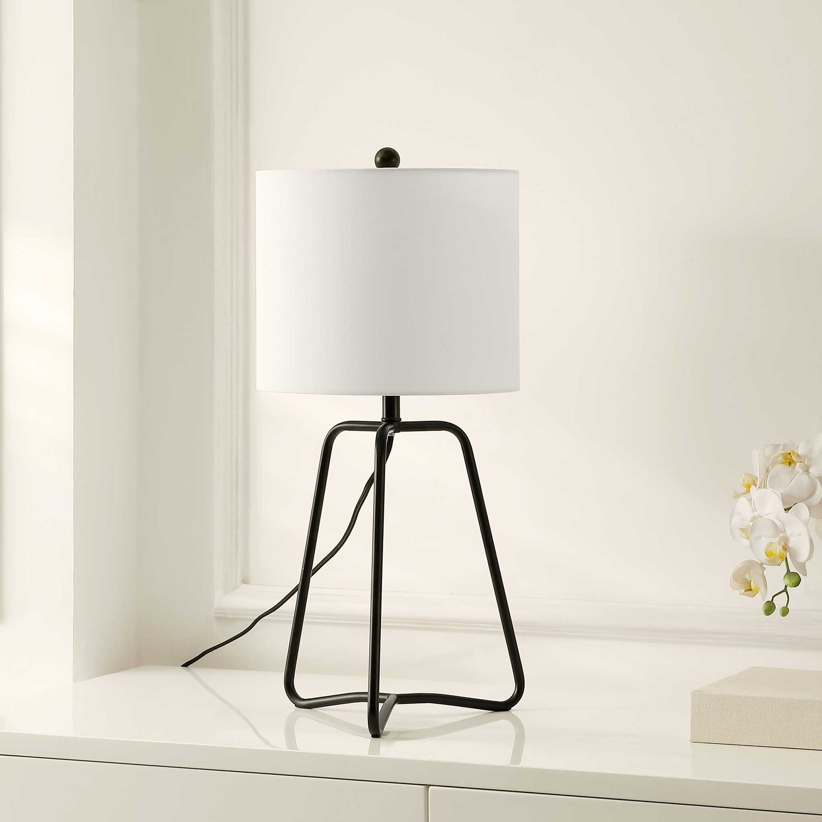 Sleek black iron table lamp with a crisp white shade for modern spaces || TBL4498A || front_angle_room