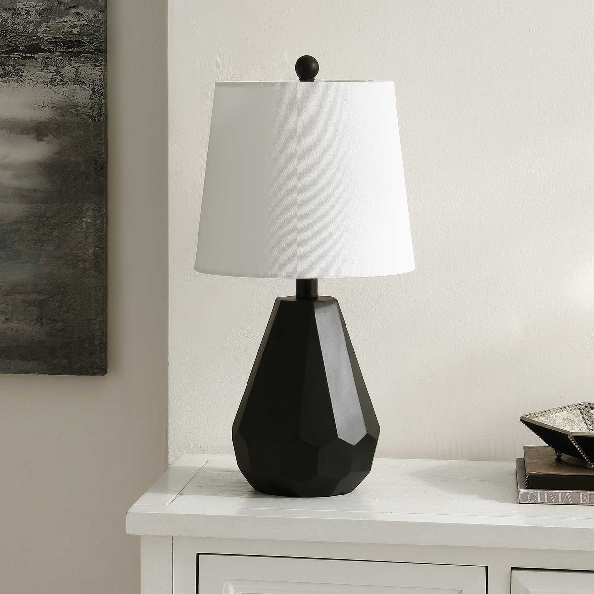 Geometric black lamp with white shade brings crisp contrast to a clean, neutral space. || TBL4499A || front_angle_room