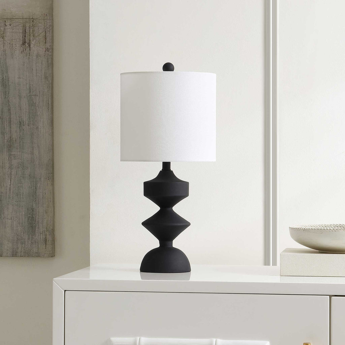 Modern black resin table lamp complements streamlined decor with a bright white shade || TBL4501A || front_angle_room