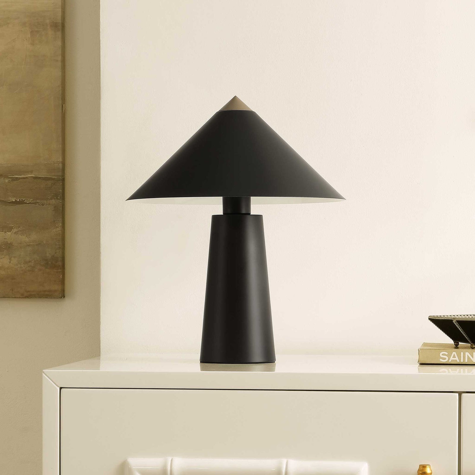 Chic black and gold lamp adds sculptural modern style to consoles, desks, and nightstands. || TBL4531A || front_angle_room