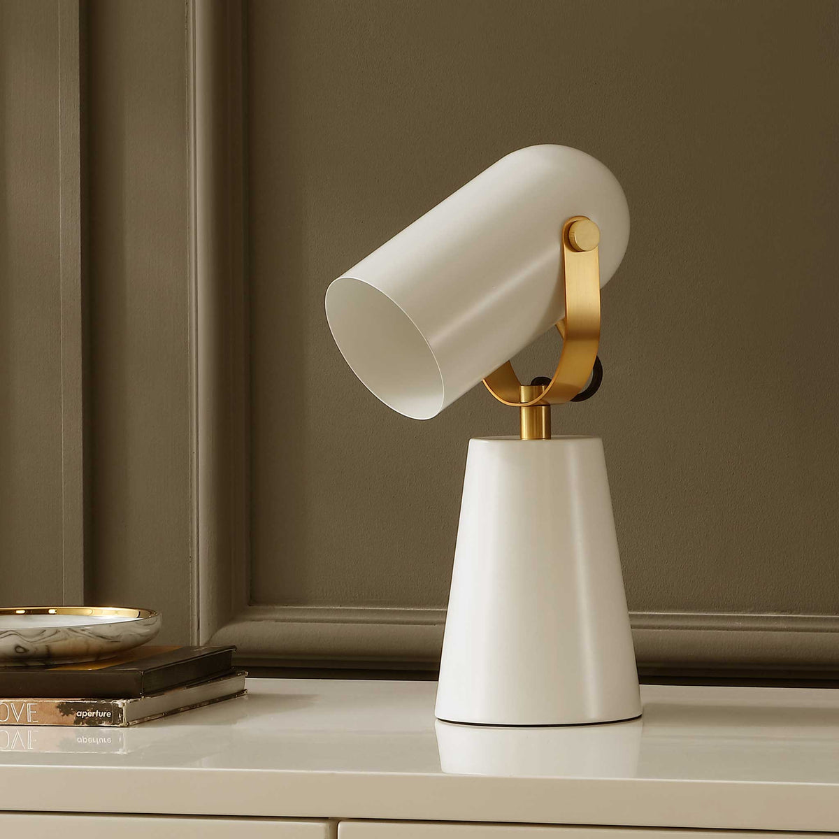 Modern white lamp with brass yoke and cone base brings clean lines and subtle shine || TBL4532A || front_angle_room