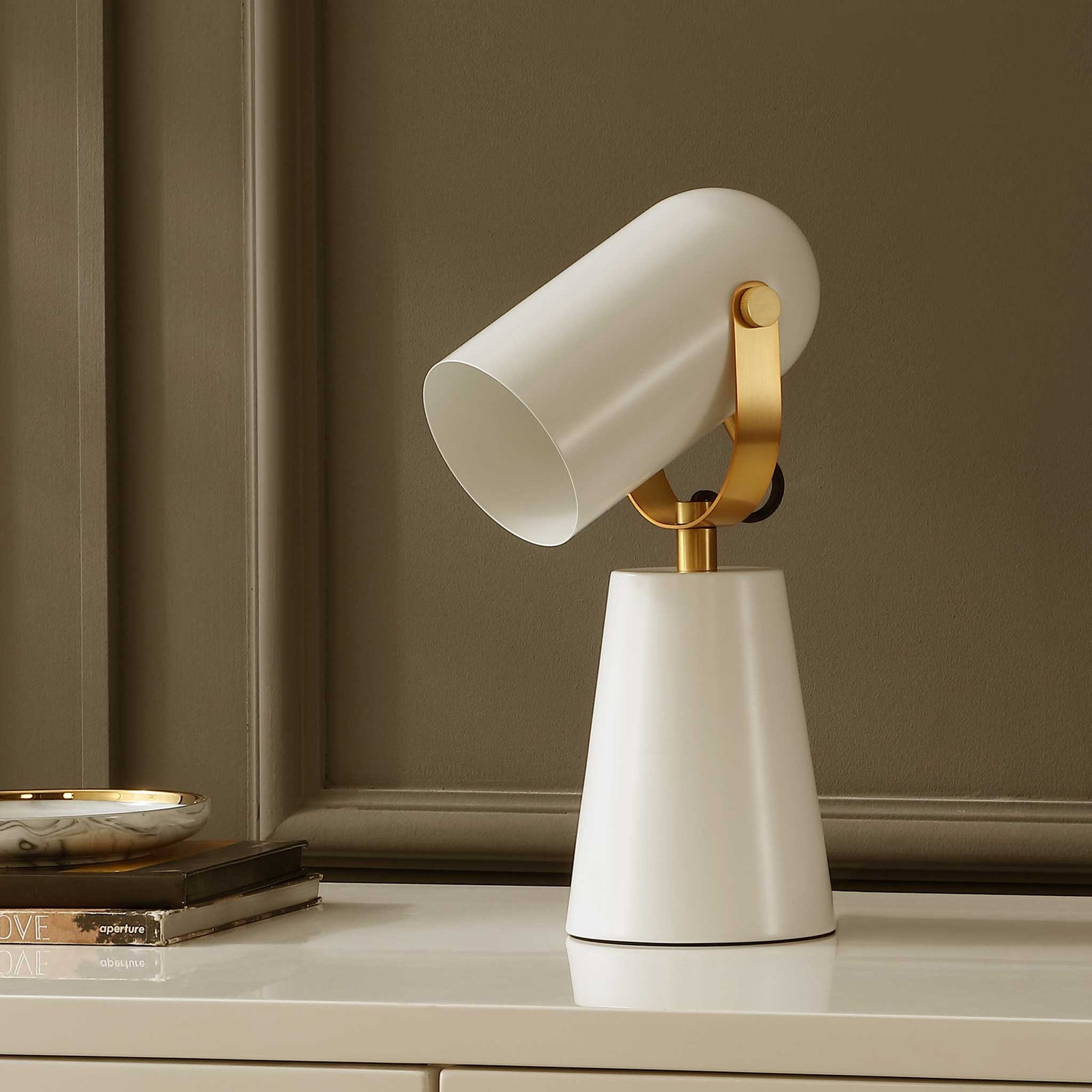 Modern white lamp with brass yoke and cone base brings clean lines and subtle shine || TBL4532A || front_angle_room