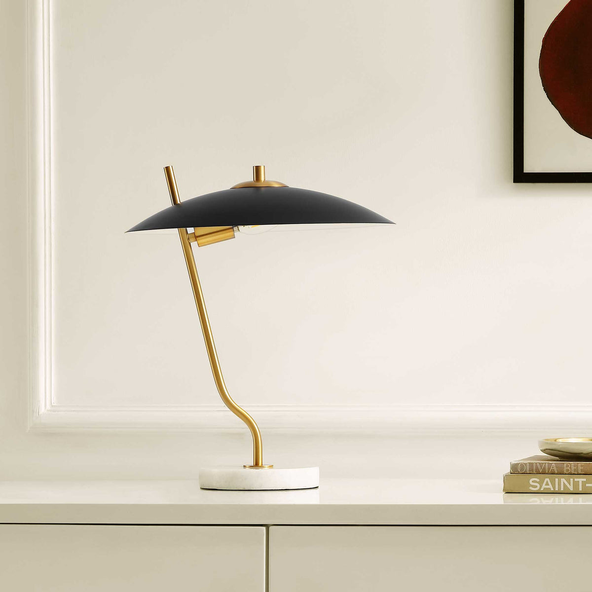 Modern table lamp with dome black shade, brass stem, and marble base elevates a clean, minimal room. || TBL4538A || front_angle_room