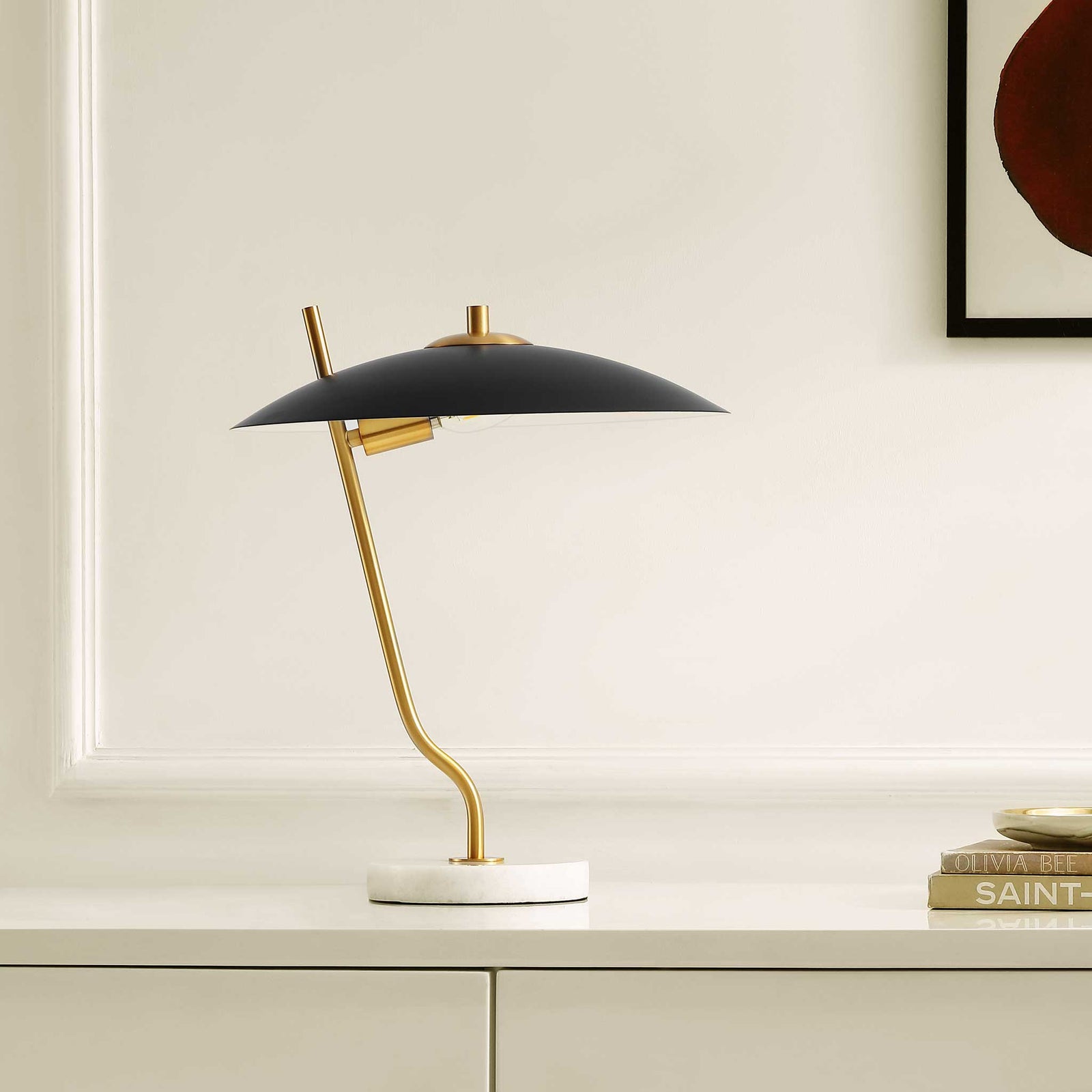 Modern table lamp with dome black shade, brass stem, and marble base elevates a clean, minimal room. || TBL4538A || front_angle_room