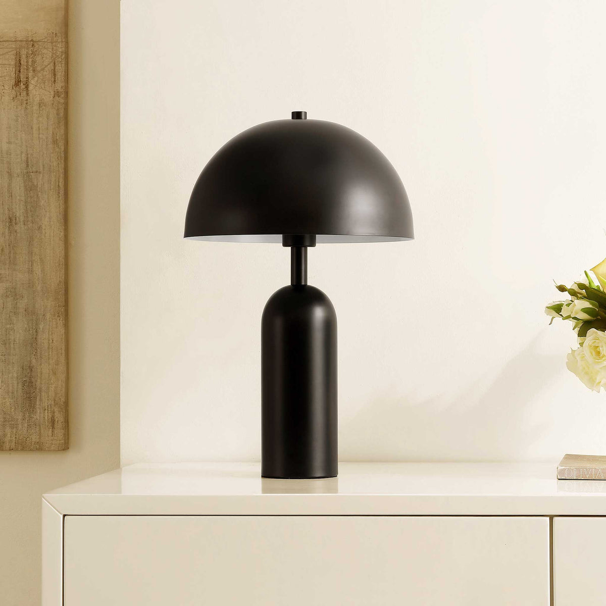 Black dome table lamp adding modern polish on a console in a bright, neutral room || TBL4539A || front_angle_room