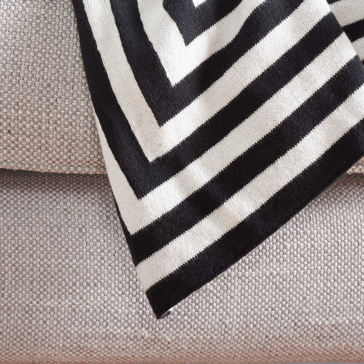 Graphic corner pattern with bold striped edging that elevates any neutral seating