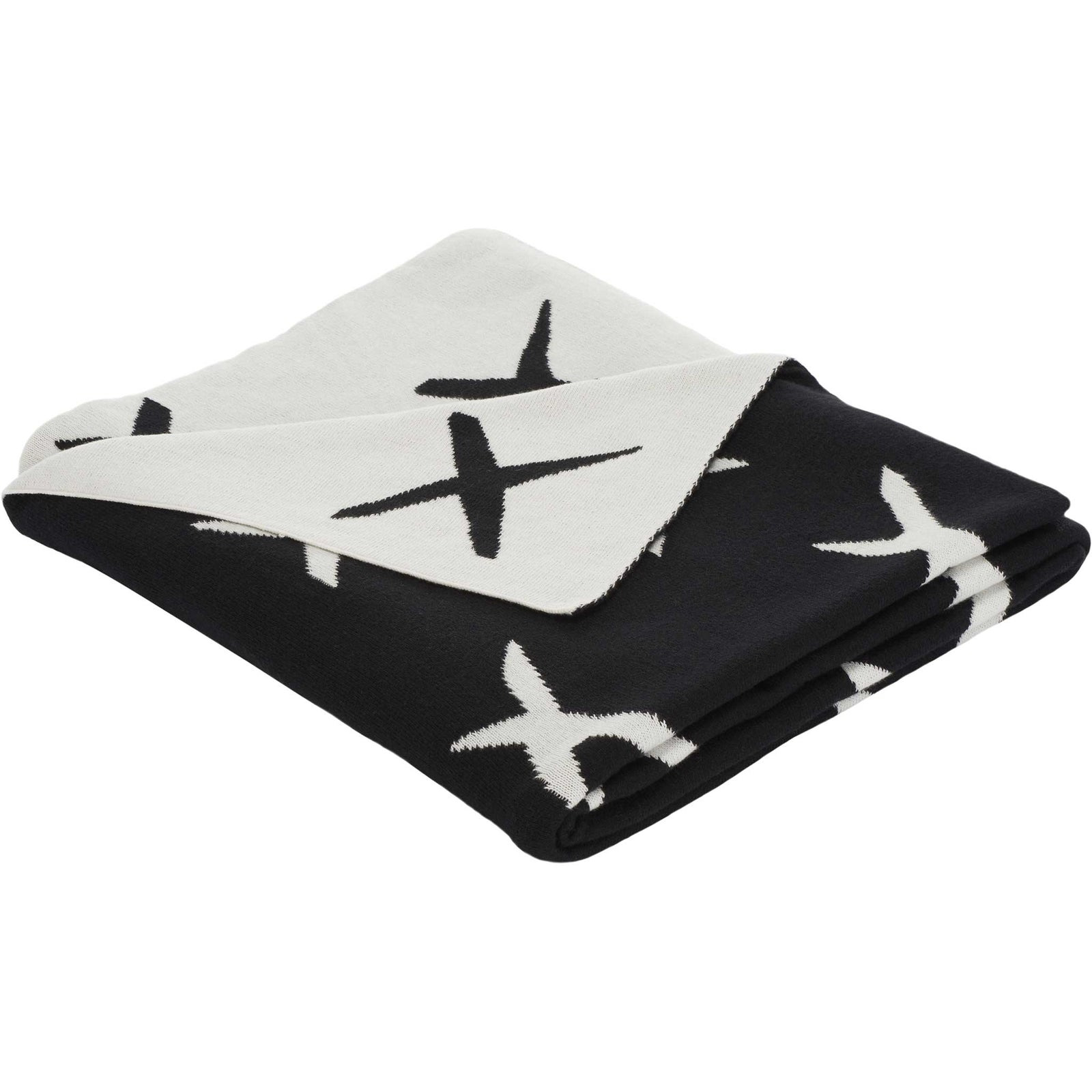 Reversible black and ivory cotton throw with bold X motif and soft, cozy knit || THR404A-5060 || front_angle_studio