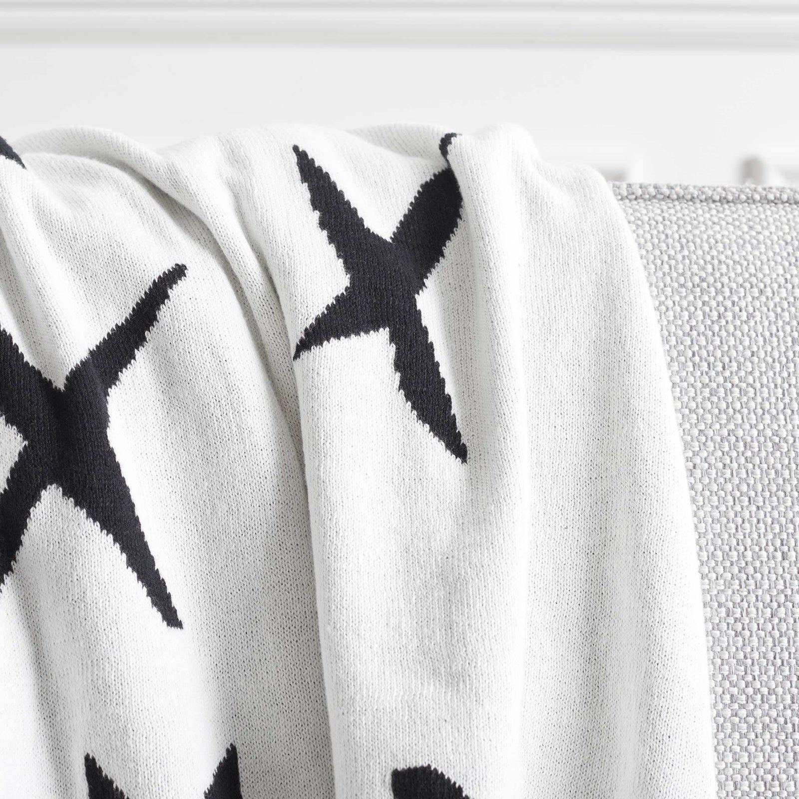 Smooth cotton knit with graphic black Xs on bright ivory for a fresh, minimalist look || THR404A-5060 || detail_room