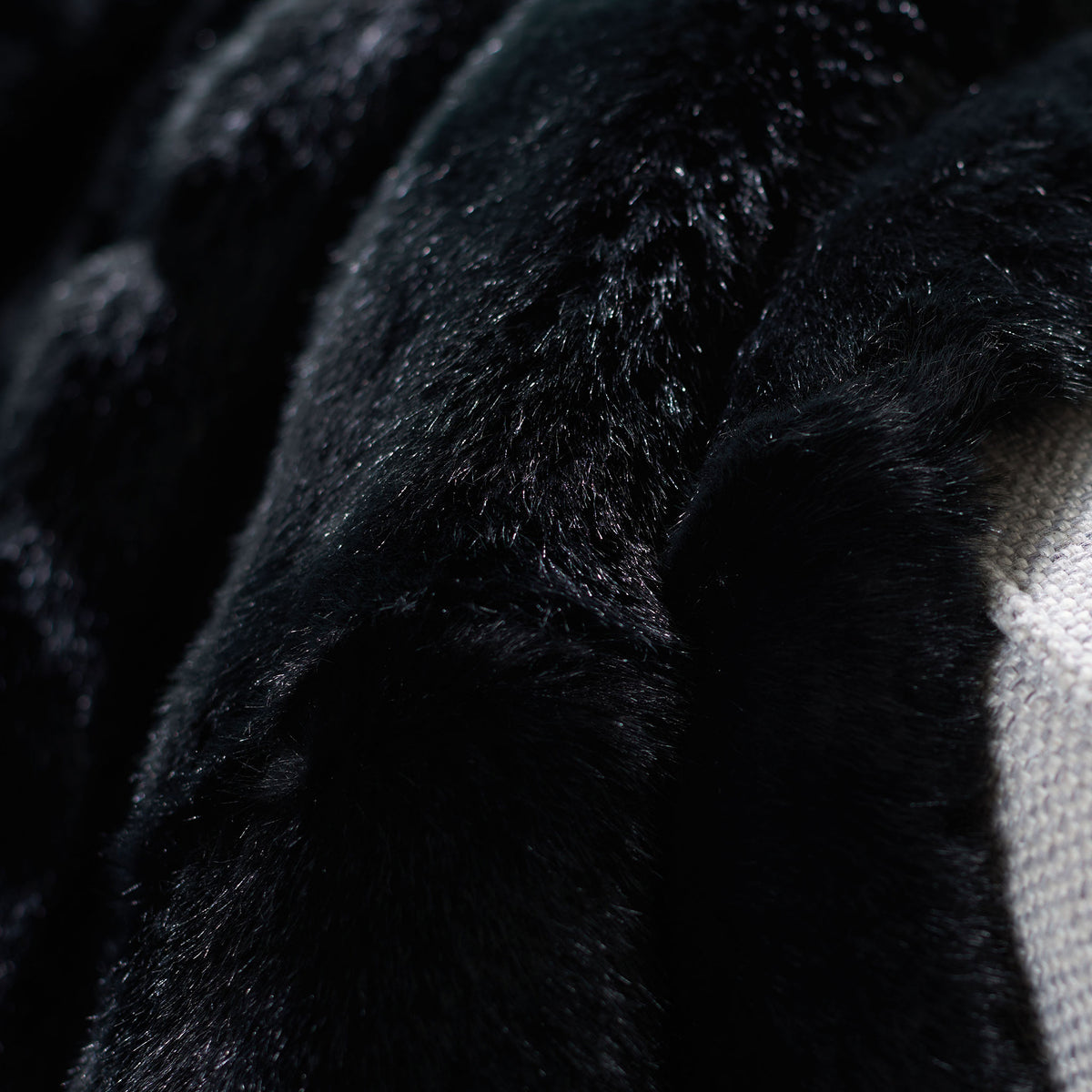 Deep black faux fur has a soft sheen and densely plush texture. || THR701A-5060 || detail_room