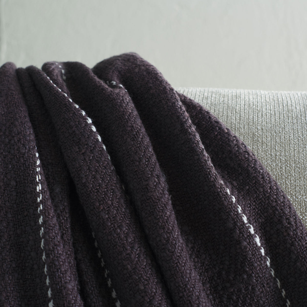 Soft cotton folds reveal a textured weave and delicate white stripes against deep charcoal gray. || THR858A-5070 || detail_room