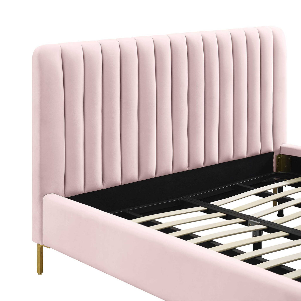 Plush blush velvet channels cushion the tall headboard, paired with a smooth upholstered side rail