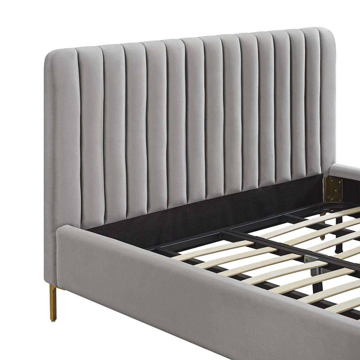 Cushioned gray velvet channels line the headboard, complemented by a smooth upholstered side rail