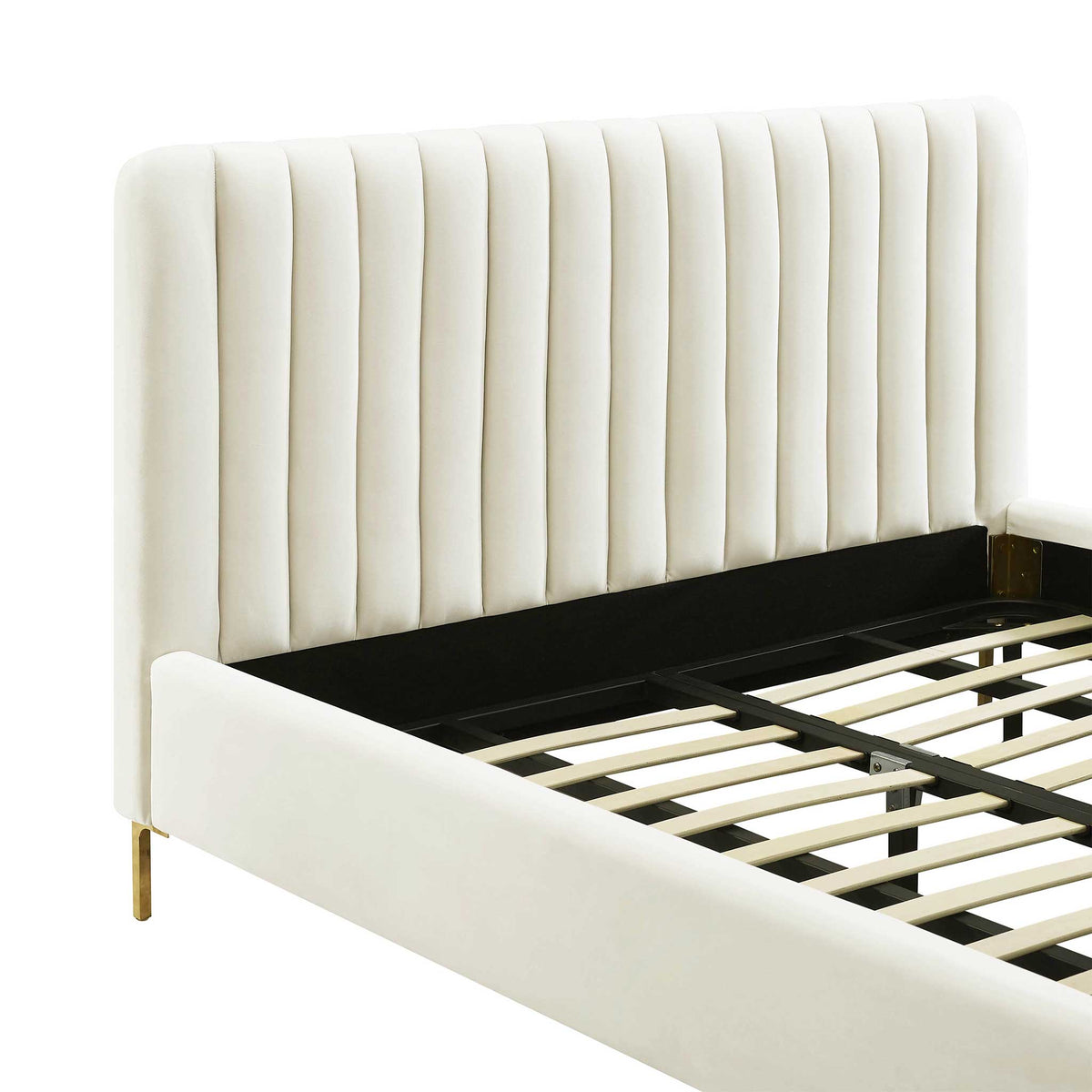Deep vertical channels bring plush texture to the cream velvet headboard above a smooth side rail