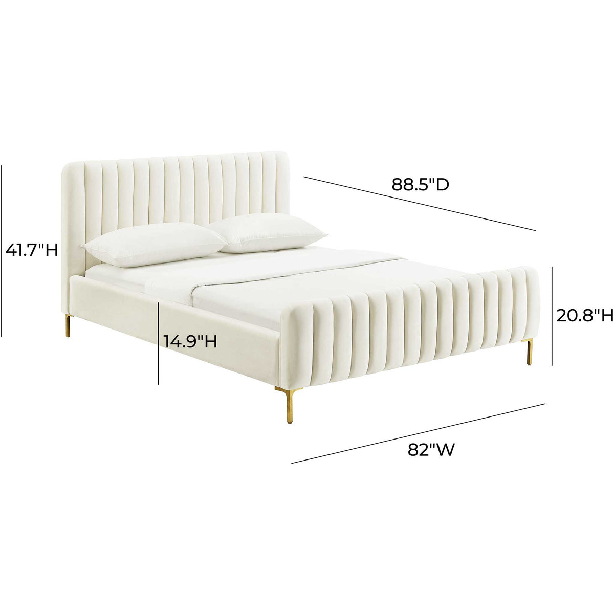 A wide king bed in cream velvet combines a channeled headboard and footboard with slim gold supports