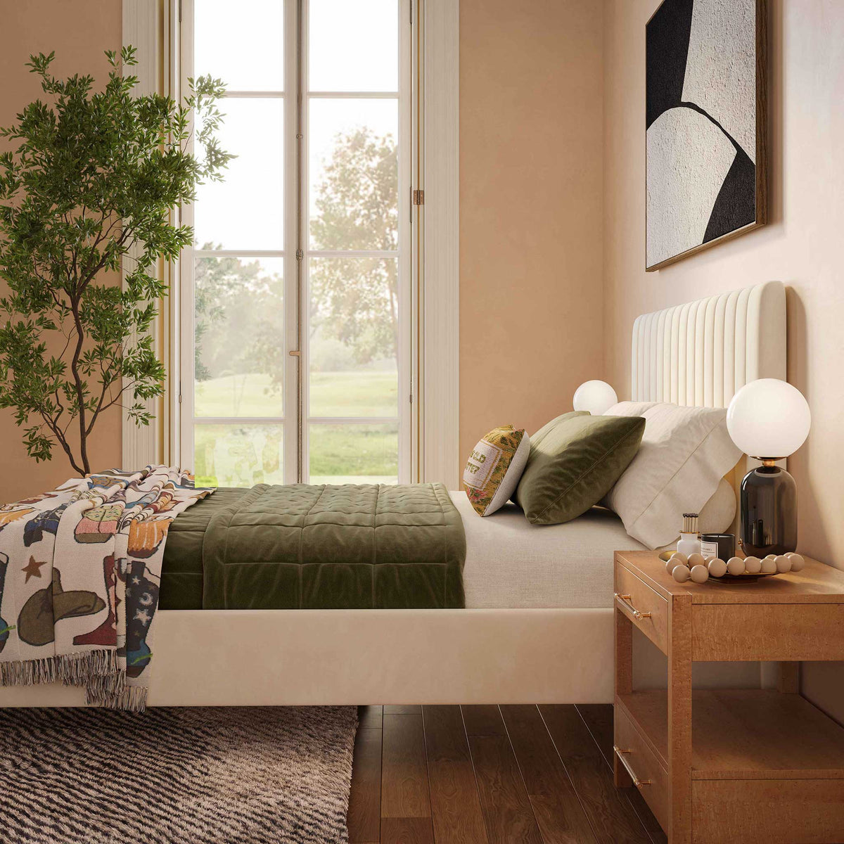 Cream velvet upholstery and a tall channeled headboard bring soft texture to a cozy bedroom