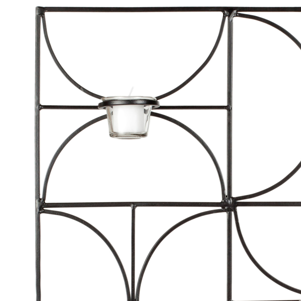 A clear glass votive holder sits within sweeping black iron curves and a geometric frame || WDC1007A || detail_studio