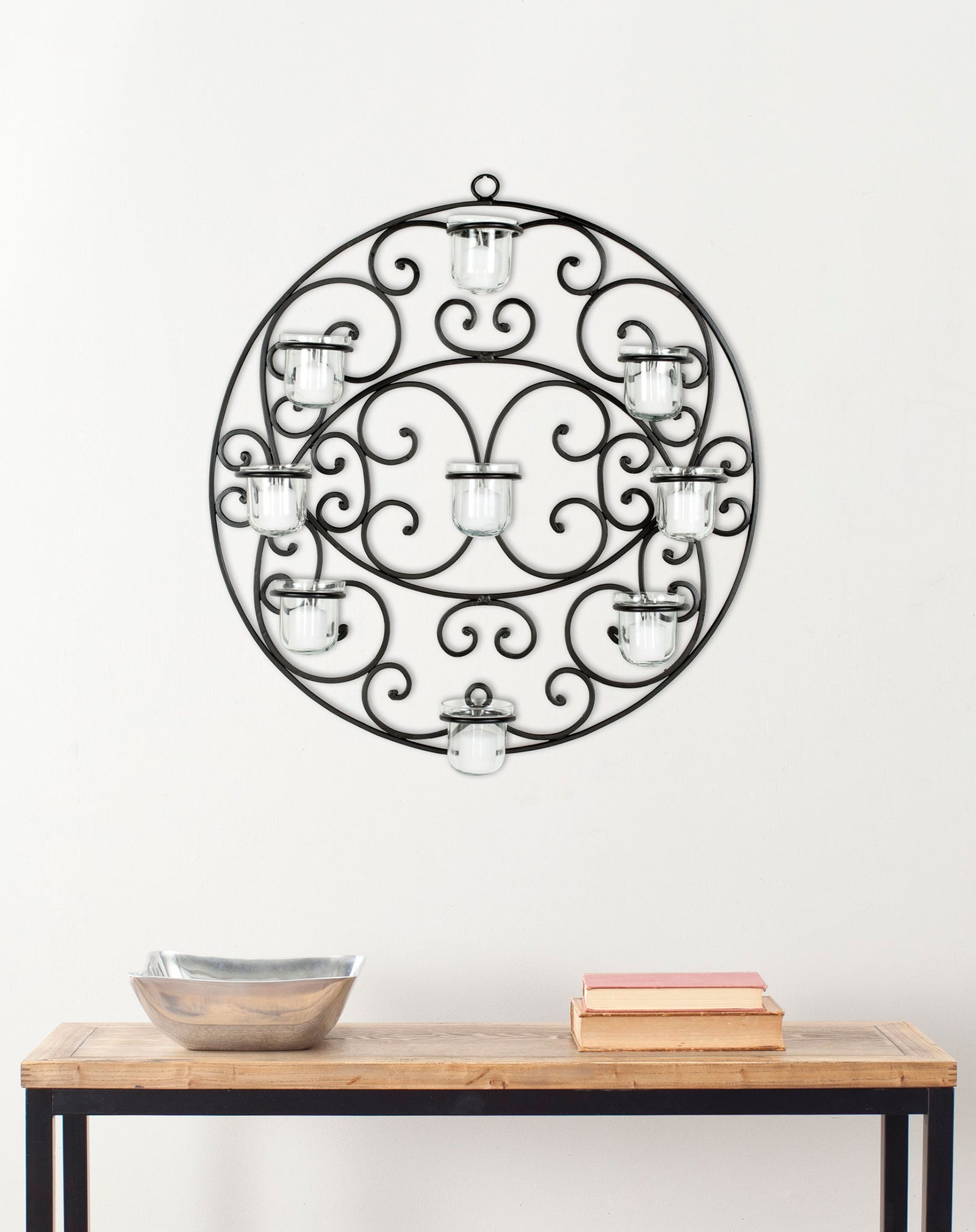 Black iron scrollwork and nine glass votive holders add warmth and character to a wall || WDC1010A || front_room