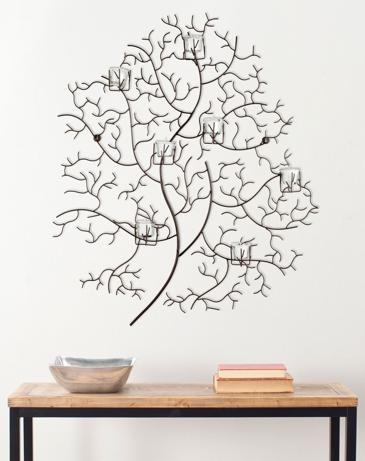 Branching iron wall decor supports seven clear glass votives for an airy, nature-inspired accent. || WDC1018A || front_room