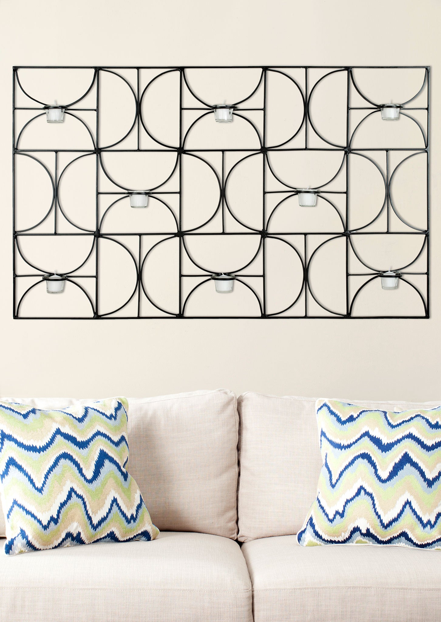 Curved black iron arcs form a graphic wall accent with eight clear glass votive holders. || WDC1019A || front_room