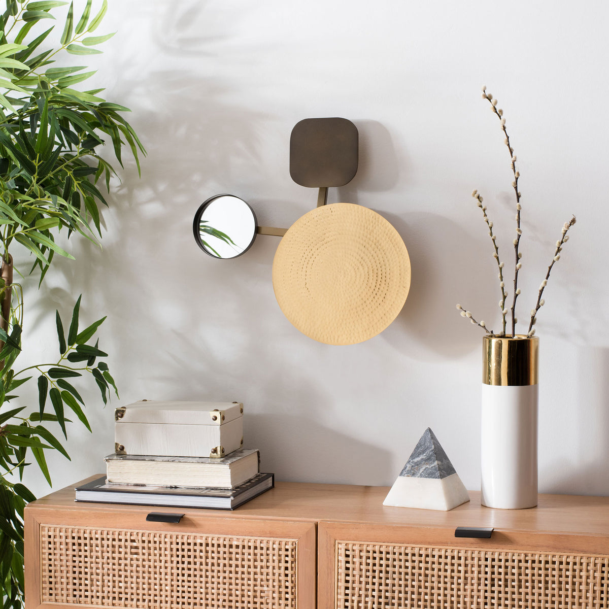 A hammered gold-tone disk and round mirror add sculptural warmth above a woven-front console || WDC1030A || front_room